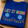 Majica z napisom LET IT SNOW, snežinkama in božičnimi lučkami