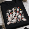 Humoristična majica z ilustracijo prestrašenih in poškodovanih kegljev