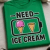 Majica z napisom —NEED— ICE CREAM in motivom baterije s sladolednim kornetom