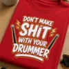 Majica z napisom DON'T MAKE SHIT WITH YOUR DRUMMER in motivom bobnarskih palic